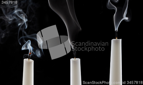 Image of extinguished candle with smoke