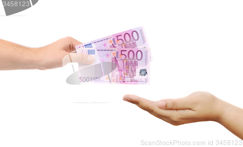 Image of Hand giving money to other hand isolated