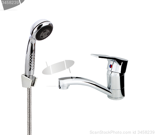 Image of silver metallic water tap with crane