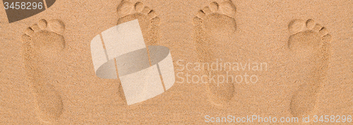 Image of Footprints in sand at the Beach