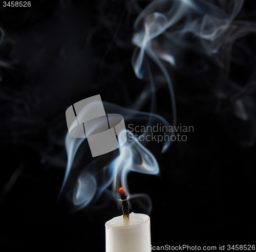 Image of Extinguished candle with smoke