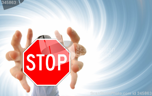 Image of Man grabing a stop sign