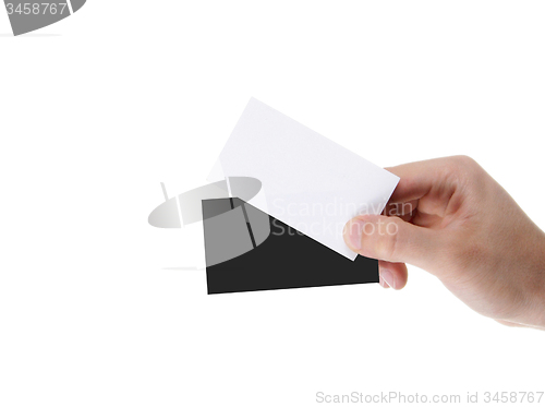 Image of hand holding blank and black business card