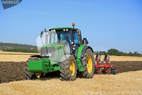 Image of John Deere 6630 Tractor and Agrolux Plow on Field