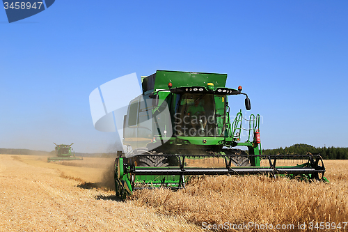 Image of Two John Deere Combines Harvest Barley