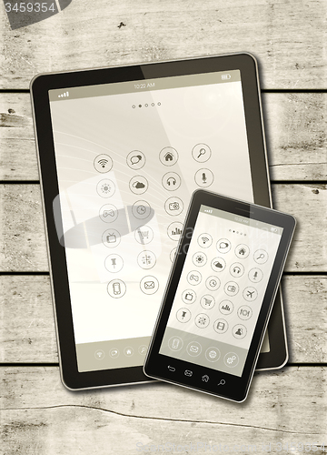 Image of Smartphone and digital tablet PC on a white wood table