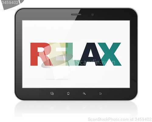 Image of Vacation concept: Tablet Computer with Relax on  display