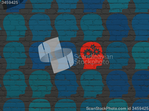Image of Education concept: head with gears icon on wall background