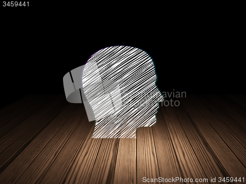 Image of Learning concept: Head in grunge dark room