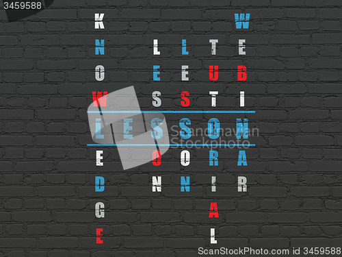 Image of Education concept: word Lesson in solving Crossword Puzzle