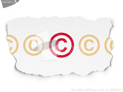 Image of Law concept: copyright icon on Torn Paper background