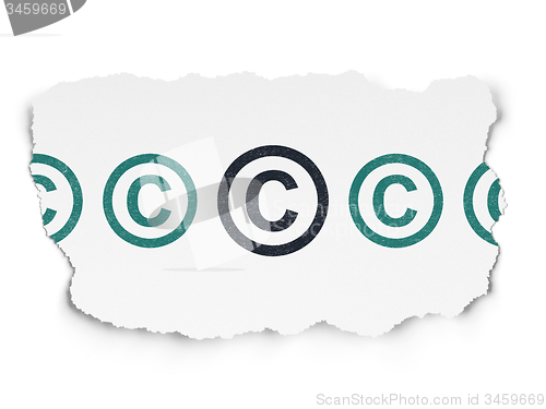 Image of Law concept: copyright icon on Torn Paper background