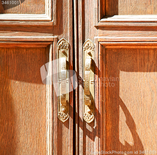 Image of door in italy old ancian wood and trasditional  texture nail