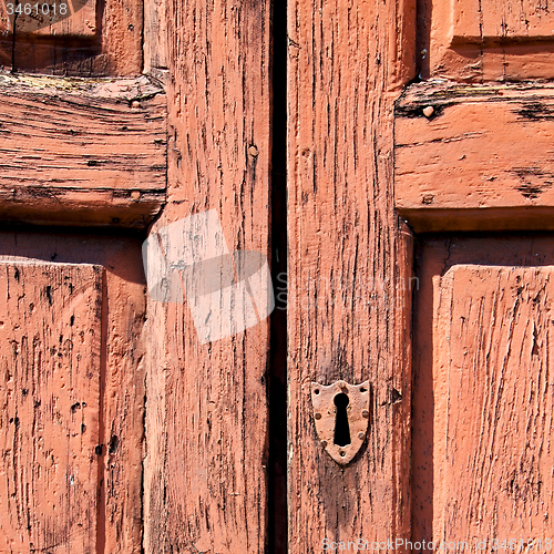 Image of door    in italy old ancian wood and traditional  texture nail