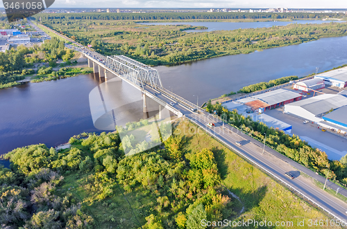 Image of Traffic ob bridge through river. Tyumen. Russia