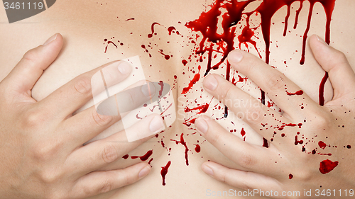 Image of Hands covering breasts - Blood