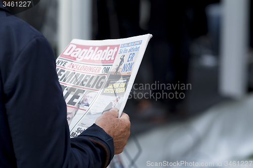 Image of Newspaper Reader