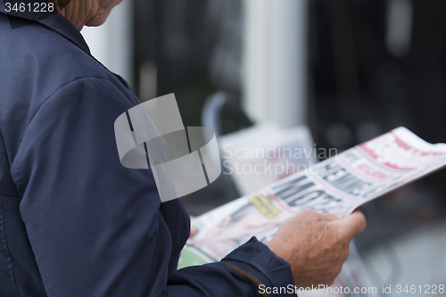 Image of Newspaper Reader