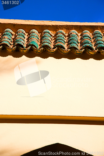Image of tile roof  moroccan old wall  