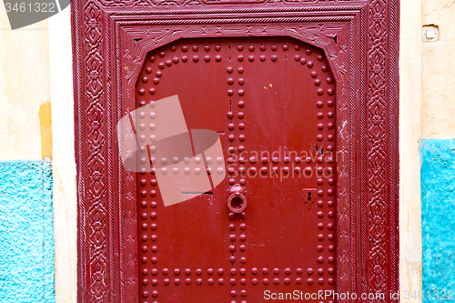 Image of old door in   ancien and wall ornate blue