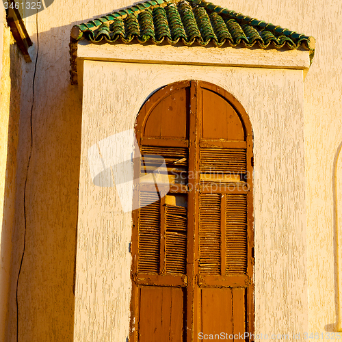 Image of   yellow window in morocco africa old construction and brown wal