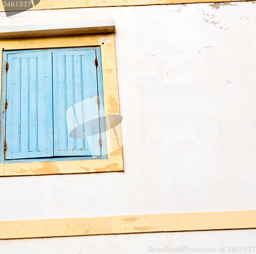 Image of blue window in morocco africa old construction and brown wall  c