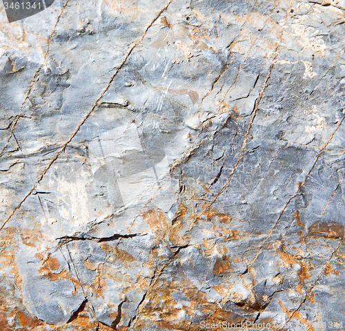 Image of rocks stone and red orange gneiss in the wall of morocco