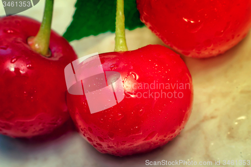 Image of Bright red delicious ripe cherries