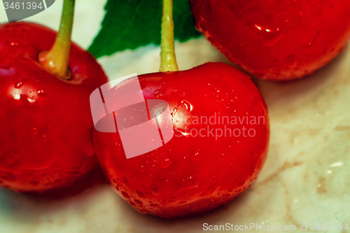 Image of Bright red delicious ripe cherries