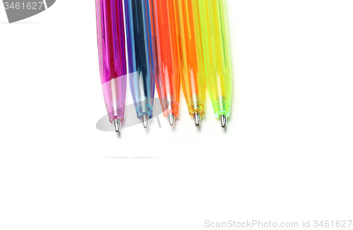 Image of Colorful pens on white background