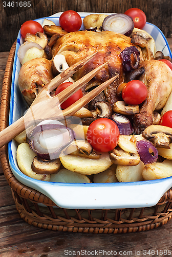 Image of baked chicken with potatoes and mushrooms
