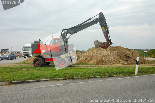 Image of red excavator