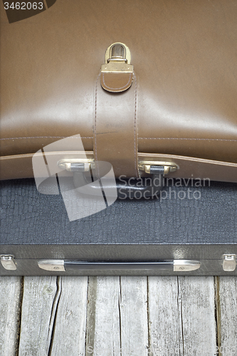 Image of two suitcases on the wooden floor