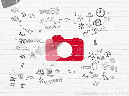Image of Vacation concept: Photo Camera on wall background