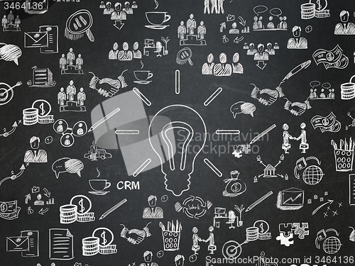 Image of Business concept: Light Bulb on School Board background