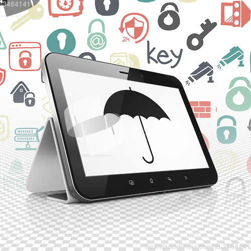 Image of Safety concept: Tablet Computer with Umbrella on display