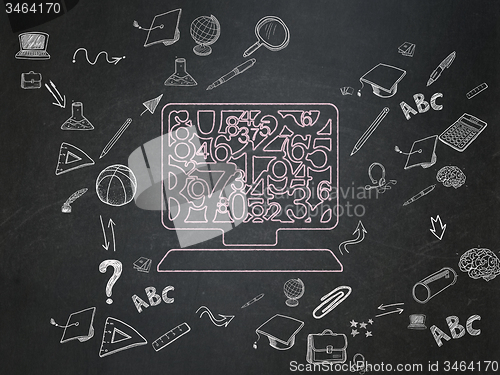 Image of Education concept: Computer Pc on School Board background