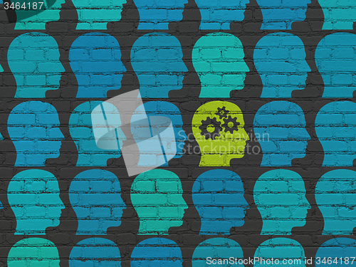 Image of Finance concept: head with gears icon on wall background