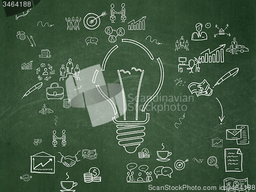 Image of Finance concept: Light Bulb on School Board background