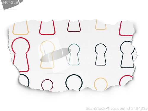 Image of Security concept: Keyhole icons on Torn Paper background