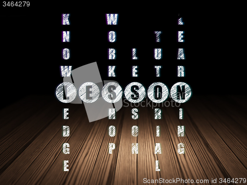 Image of Education concept: word Lesson in solving Crossword Puzzle