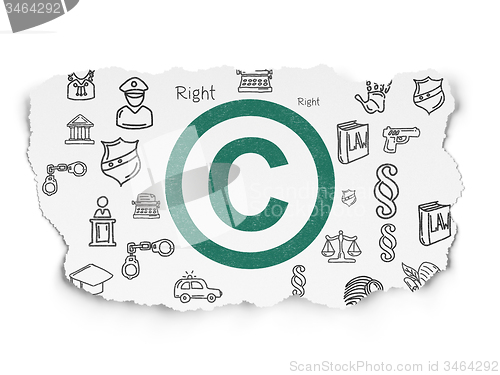 Image of Law concept: Copyright on Torn Paper background