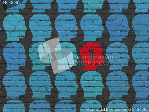 Image of Education concept: head with keyhole icon on wall background