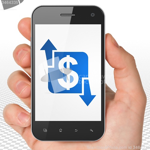 Image of Business concept: Hand Holding Smartphone with Finance on display