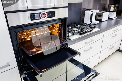 Image of Modern hi-tek kitchen, oven with open door