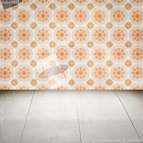 Image of Wood table top and blur vintage ceramic tile pattern wall