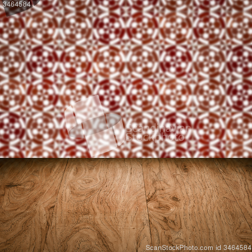 Image of Wood table top and blur vintage ceramic tile pattern wall