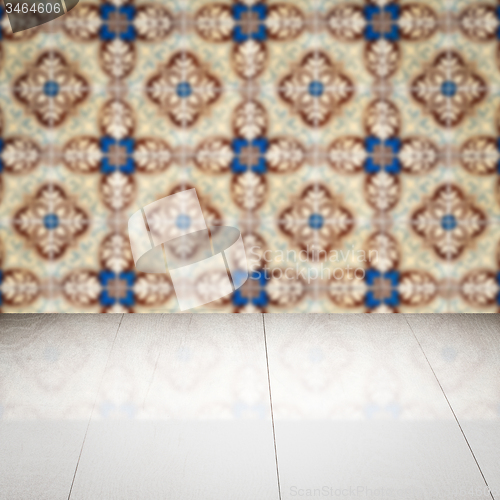Image of Wood table top and blur vintage ceramic tile pattern wall