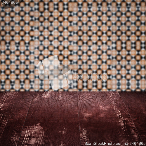 Image of Wood table top and blur vintage ceramic tile pattern wall
