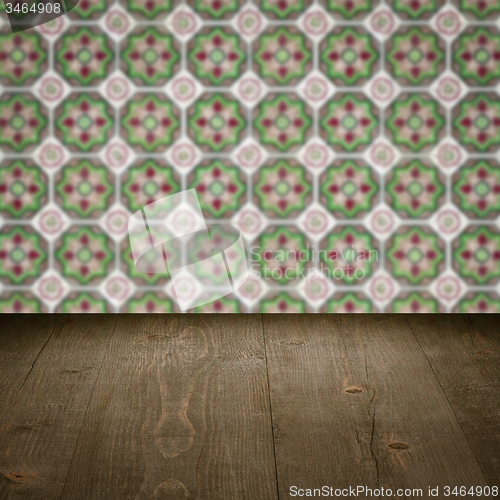 Image of Wood table top and blur vintage ceramic tile pattern wall